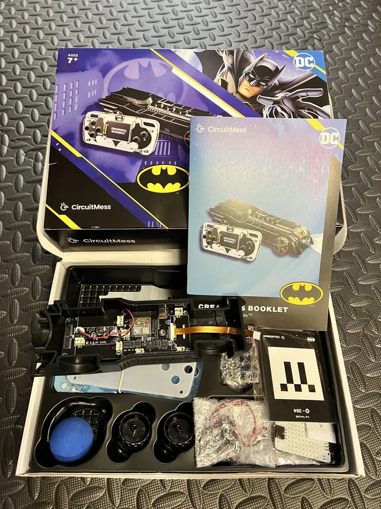 A CircuitMess Batmobile kit being built, showing the ESP32 board and components